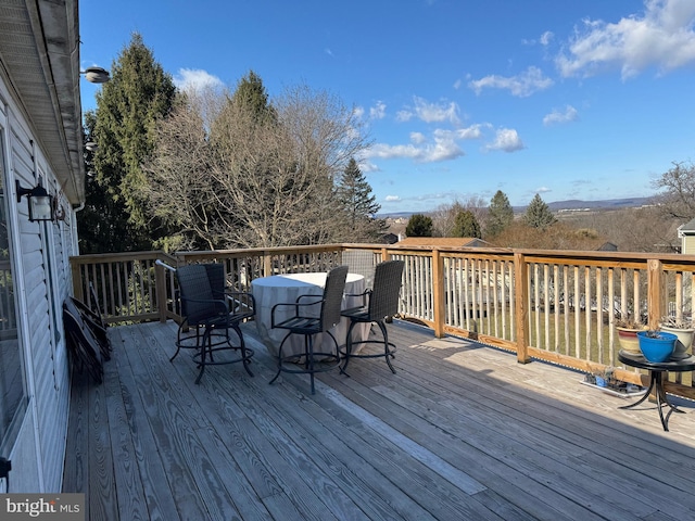 deck featuring outdoor dining area