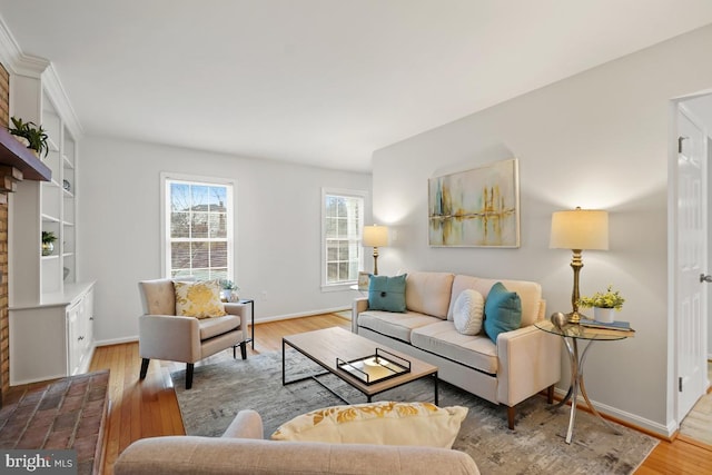 living room featuring baseboards and wood finished floors