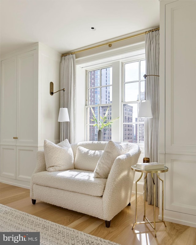 sitting room with light wood-style flooring