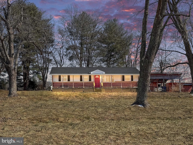 ranch-style home with a front lawn