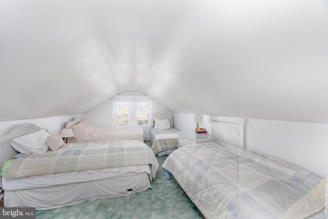 carpeted bedroom featuring lofted ceiling