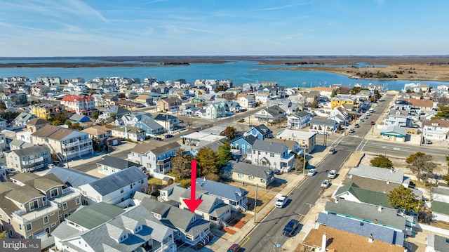 bird's eye view with a residential view and a water view