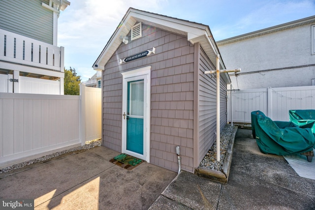 view of shed with a fenced backyard