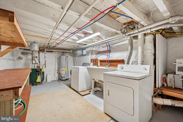 unfinished basement with water heater, a heating unit, and washer and dryer