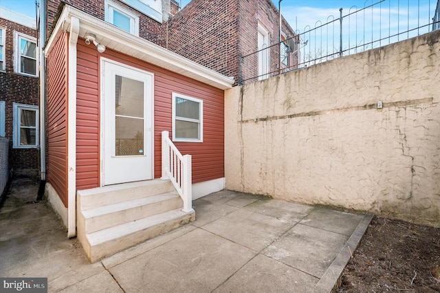 doorway to property with a patio