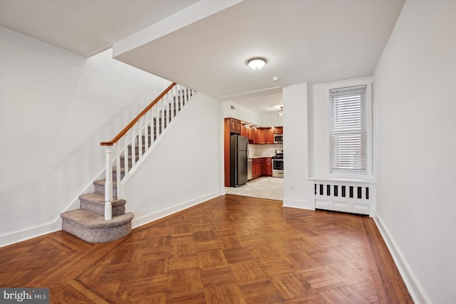 entryway featuring stairway and baseboards