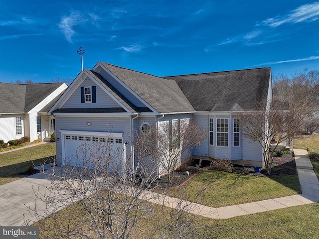 view of front of house with a garage, concrete driveway, a shingled roof, and a front lawn