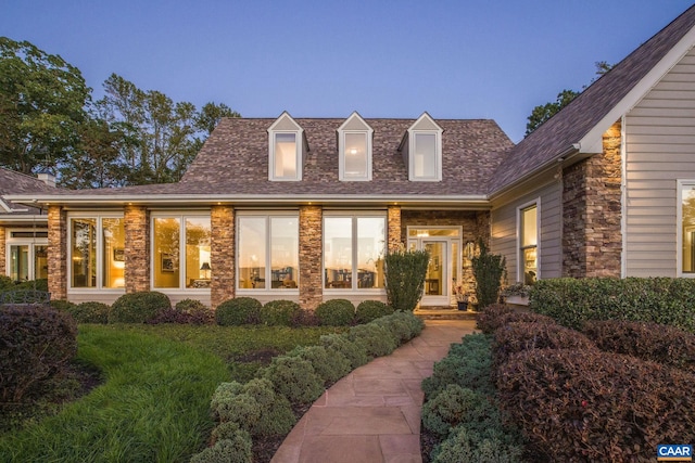 exterior space with stone siding