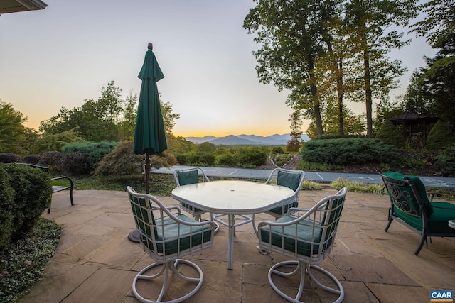 patio terrace at dusk with outdoor dining space