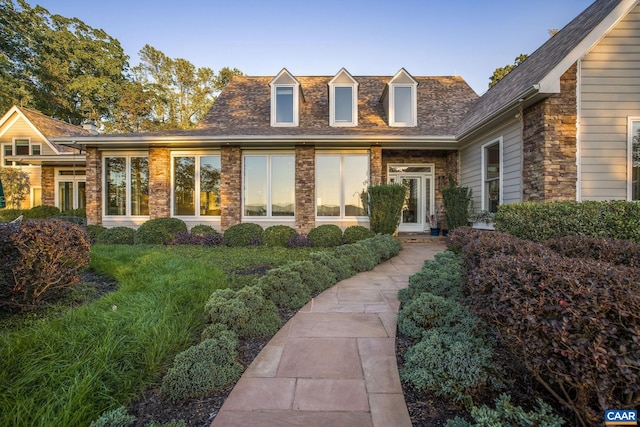 view of front of house featuring brick siding