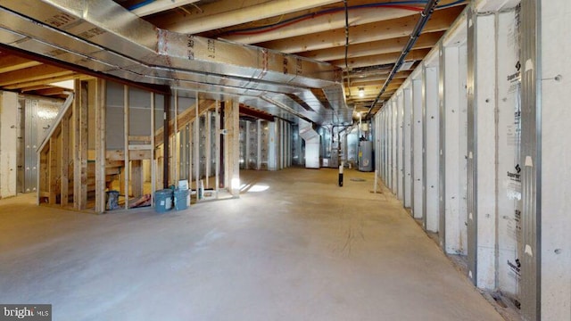 unfinished below grade area featuring water heater