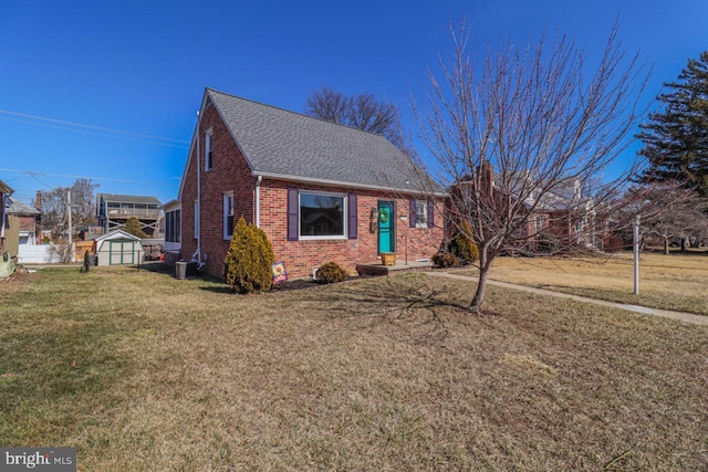 view of front of home featuring brick siding, central AC, a front lawn, and roof with shingles