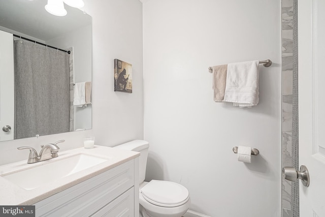 full bath with vanity and toilet