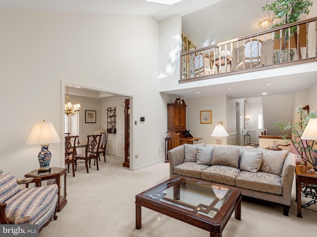 living room featuring a towering ceiling, recessed lighting, a notable chandelier, and light colored carpet