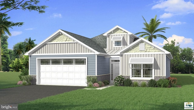 craftsman inspired home featuring board and batten siding, a front lawn, a garage, and aphalt driveway