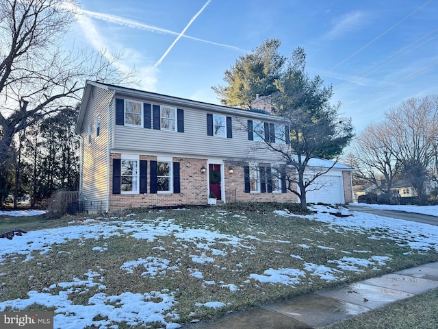 view of front facade featuring a garage, a chimney, and brick siding