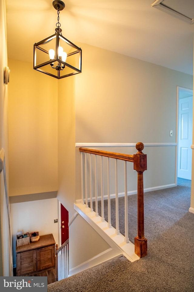 stairway with carpet and baseboards