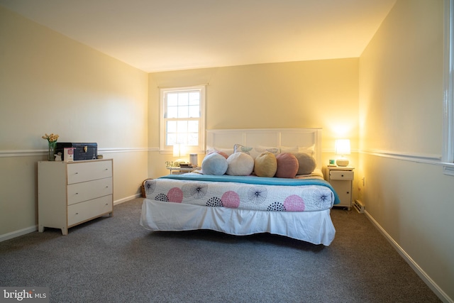 bedroom with baseboards and carpet flooring