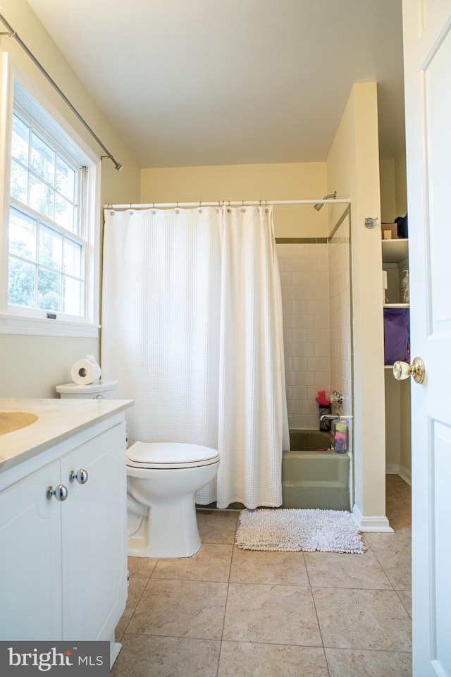 full bath featuring vanity, tile patterned flooring, toilet, and shower / bathtub combination with curtain