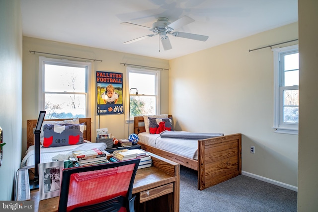 bedroom with carpet flooring, a ceiling fan, and baseboards