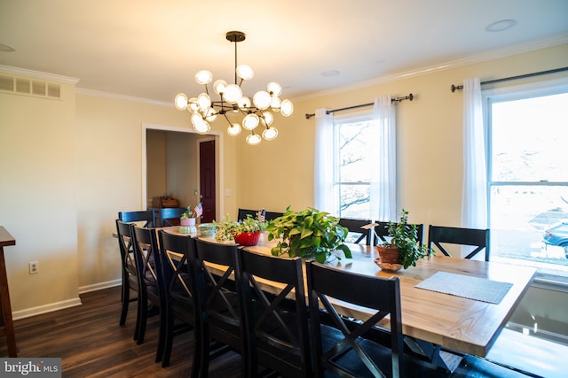 dining space featuring crown molding, visible vents, baseboards, dark wood-style floors, and an inviting chandelier