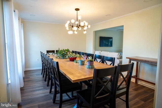 dining room featuring dark wood-type flooring, crown molding, baseboards, and an inviting chandelier