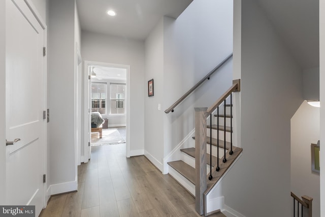 interior space with recessed lighting, baseboards, and wood finished floors