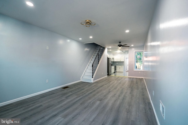 unfurnished living room featuring recessed lighting, visible vents, baseboards, and wood finished floors