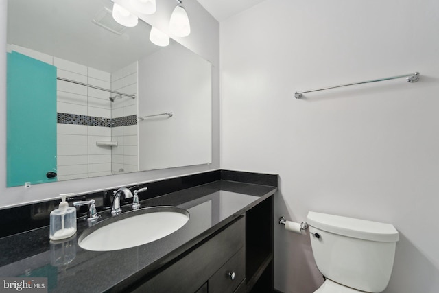 bathroom featuring a shower, visible vents, vanity, and toilet