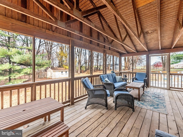 sunroom / solarium with vaulted ceiling