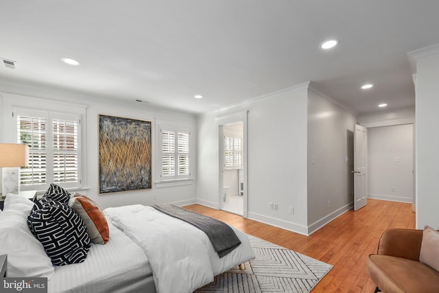 bedroom featuring light wood-type flooring, multiple windows, baseboards, and recessed lighting