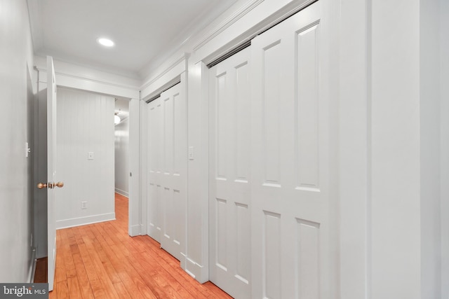 hallway featuring light wood-style floors, recessed lighting, and baseboards