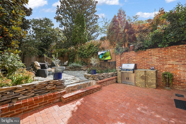 view of patio / terrace featuring area for grilling, grilling area, and a fenced backyard