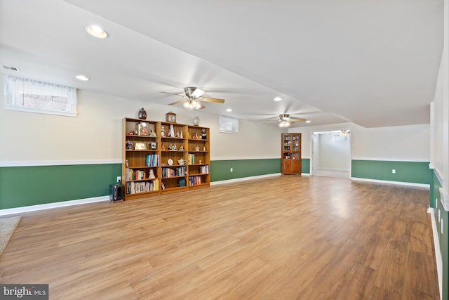 interior space with recessed lighting, ceiling fan, baseboards, and light wood-type flooring