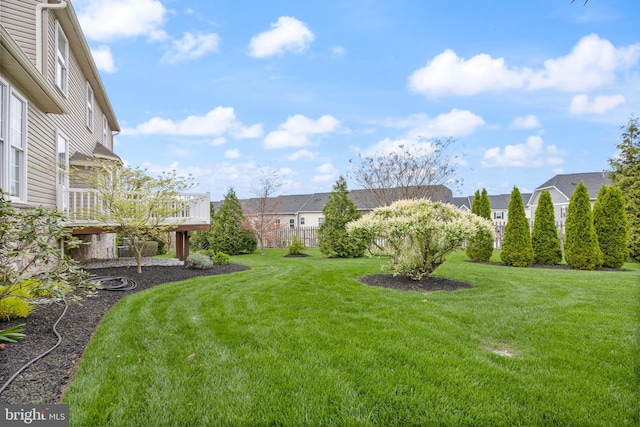view of yard with a deck and a residential view