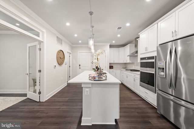 kitchen featuring stainless steel appliances, a kitchen island, white cabinetry, hanging light fixtures, and light countertops