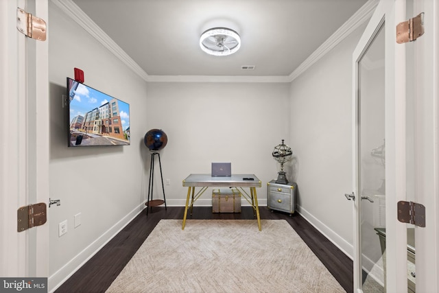 office featuring baseboards, visible vents, dark wood finished floors, and crown molding