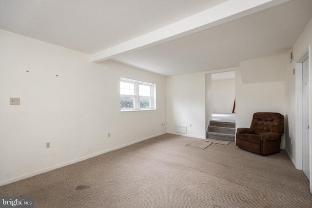 unfurnished room featuring carpet floors, baseboards, stairway, and beam ceiling