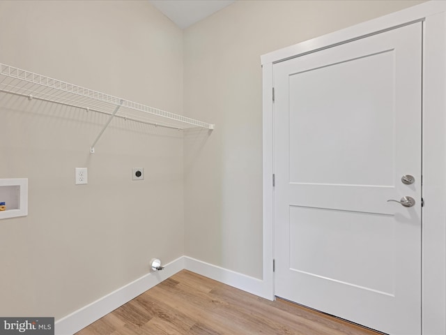 laundry area featuring hookup for a washing machine, hookup for an electric dryer, laundry area, wood finished floors, and baseboards