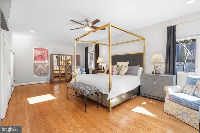 bedroom featuring ceiling fan, wood finished floors, and recessed lighting