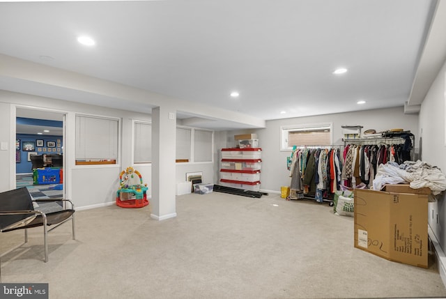 walk in closet with carpet flooring