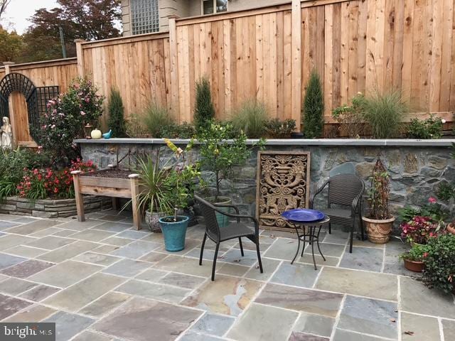 view of patio / terrace featuring fence