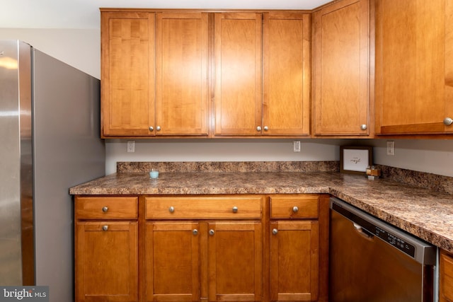 117 Quaker Neck Rd, Salem, NJ 08079 - kitchen featuring stainless steel appliances, dark countertops, and brown cabinetry