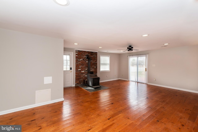 117 Quaker Neck Rd, Salem, NJ 08079 - unfurnished living room featuring baseboards, recessed lighting, light wood-style flooring, a wood stove, and a ceiling fan