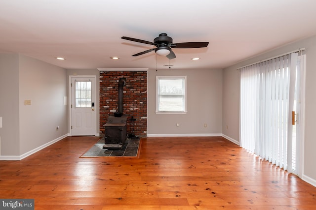 117 Quaker Neck Rd, Salem, NJ 08079 - unfurnished living room featuring a ceiling fan, baseboards, a wood stove, recessed lighting, and hardwood / wood-style flooring