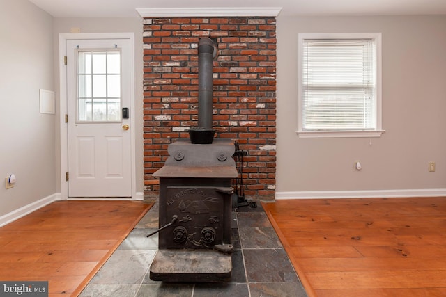 117 Quaker Neck Rd, Salem, NJ 08079 - interior space with a wood stove, wood finished floors, and baseboards