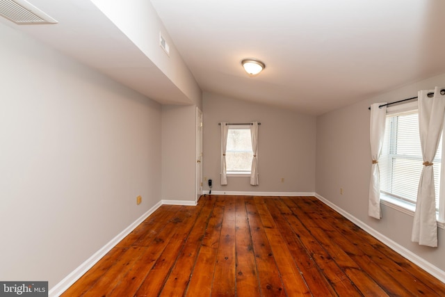 117 Quaker Neck Rd, Salem, NJ 08079 - empty room with visible vents, lofted ceiling, a healthy amount of sunlight, and wood-type flooring