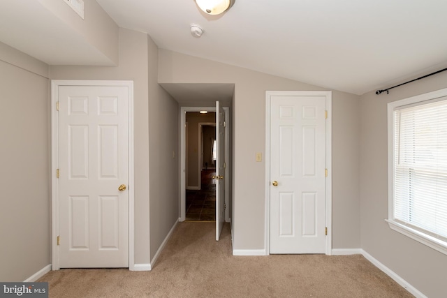 117 Quaker Neck Rd, Salem, NJ 08079 - unfurnished bedroom featuring vaulted ceiling, multiple windows, baseboards, and light carpet