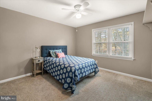 bedroom featuring carpet, baseboards, and a ceiling fan