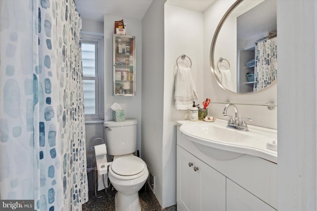 bathroom featuring toilet, a shower with curtain, and vanity